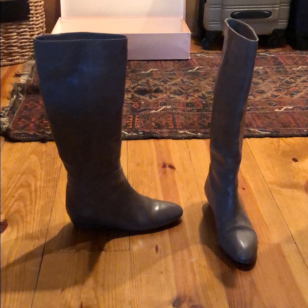 Lightly worn grey boots